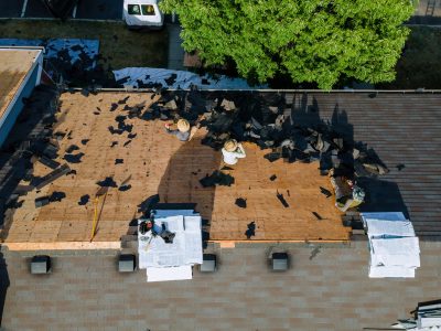 Working roofers on replacing the roof of residential building in the renovation roof the house